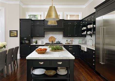 kitchen with black marbled countertops white cabinets stainless steel appliances|black cabinets with white base.